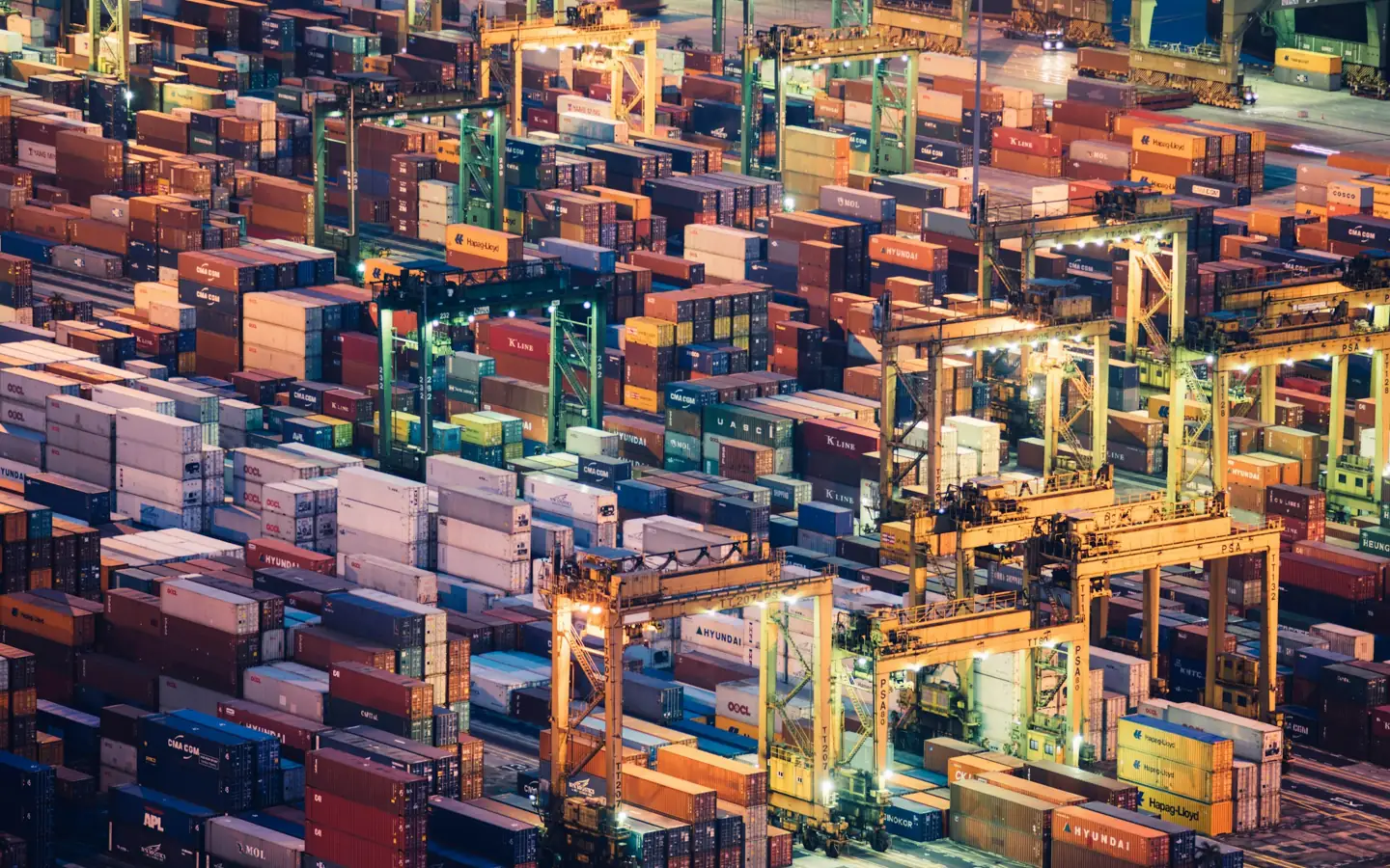Shipping containers and cranes at a freight terminal